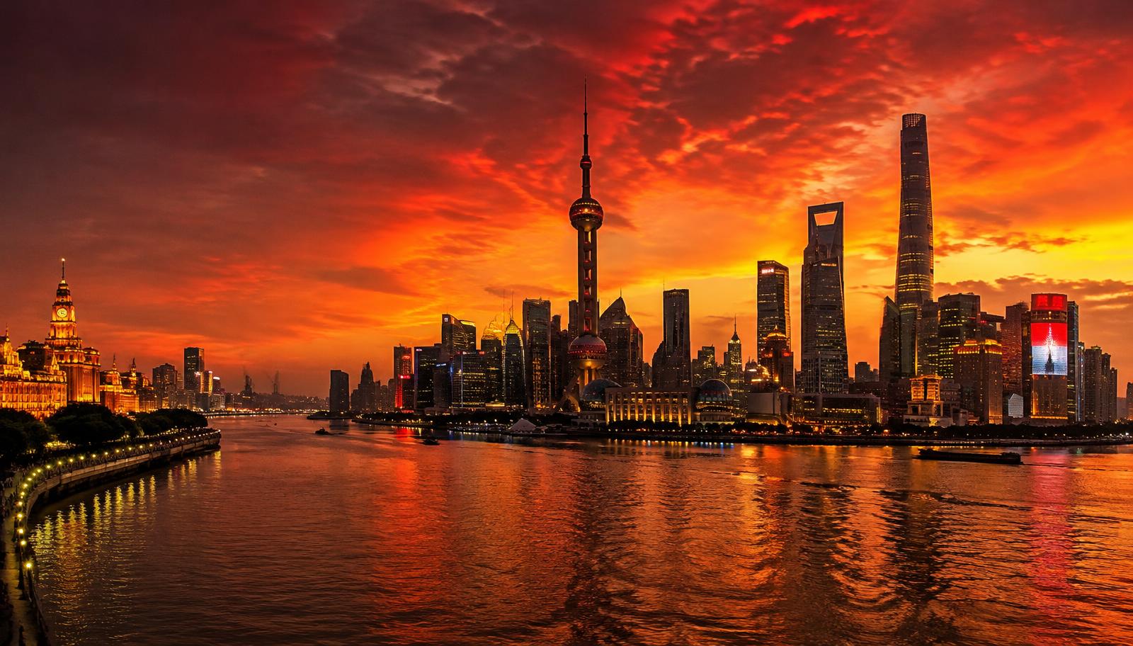 Shanghai skyline at dusk across the Huangpu River